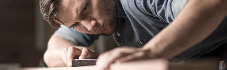 Young carpenter is building something newの写真素材