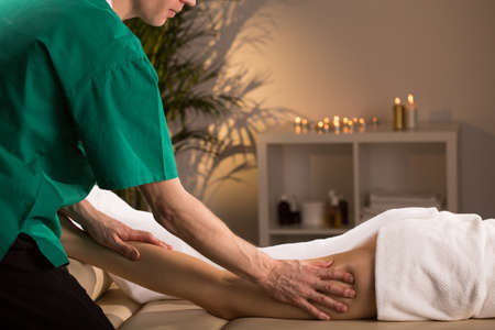 Woman having smoothing and anti-cellulite legs massage
