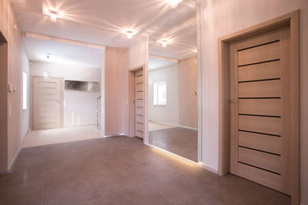 Hallway in modern commodious house with integrated lightingの写真素材