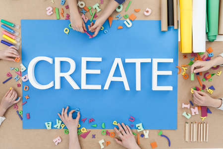 Creative children building words on blue backgroundの写真素材