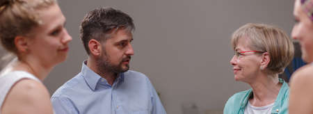 People are exchanging theirs experiences in a support groupの写真素材