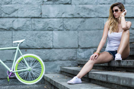 Image of sporty blonde teenager spending leisure time outdoor Image of sporty blonde teenager spending leisure time outdoor