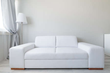 Close up of white comfortable leather double sofaの写真素材