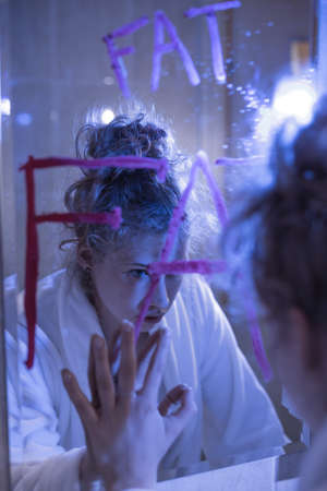Photo of young woman under pressure of being thin