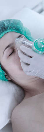 Closeup of medical staff preparing patient for a surgeryの写真素材