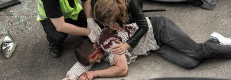 Unconscious bleeding man after dangerous car crashの写真素材