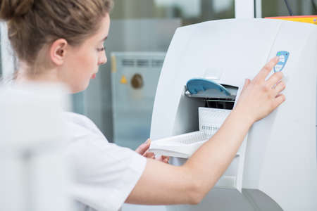 Lab technician using modern equipment in laboratoryの写真素材