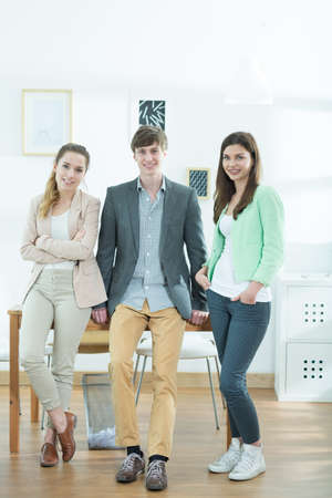 Young team of creative designers standing togetherの写真素材