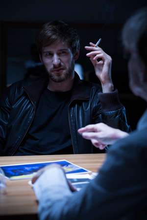 Young man being examined on police station
