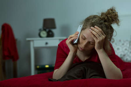 Despair woman talking on the phone with friend