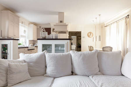 Living room with kitchenette in the storey houseの写真素材