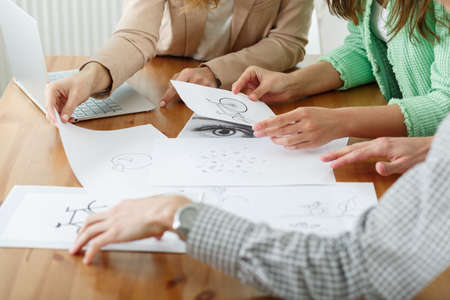 Close-up of designers working on a creative projectの写真素材