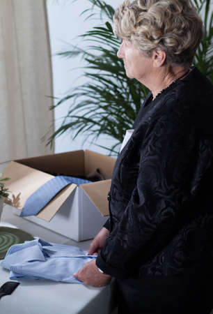 Sad lonely senior woman in mourning clothes