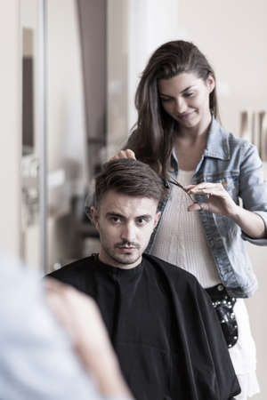 Picture of young female hairdresser and male customerの写真素材