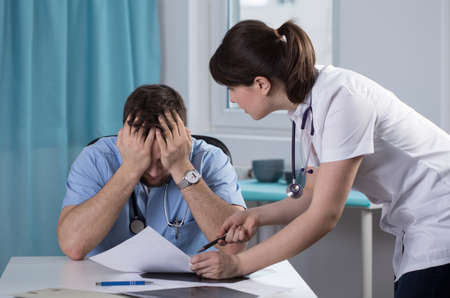 Two young doctors cannot agree on the diagnosisの写真素材