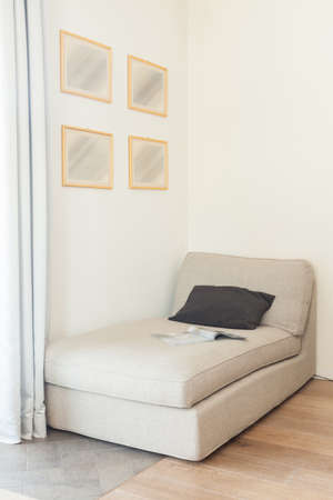 Comfortable beige couch in beige simply interiorの写真素材