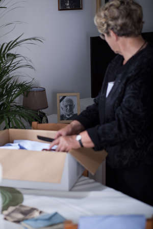 Sad senior woman missing for dead husbandの写真素材