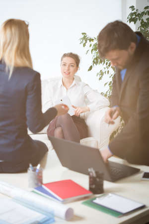 Corporate workers talking and laughing during lunch hourの写真素材