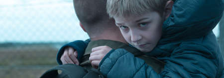 Little boy is holding his fatherの写真素材