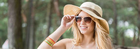 Portrait of pretty young girl in summer hat