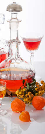 Carafes of homemade herb and fruit liqueurの写真素材