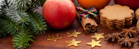 Christmas decoration, fruits and sweets on woodの写真素材