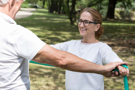 Picture of elderly pair workout with fitness elastic bandの写真素材