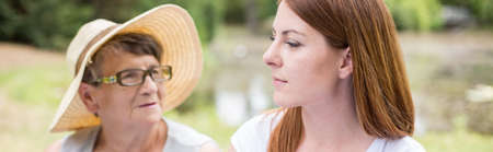 Panorama of young woman and her grandmother