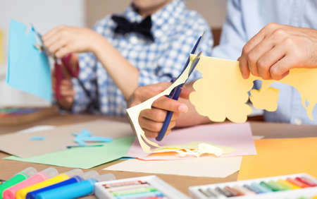 Image of schoolboy developing his artistic hobby in art classの写真素材