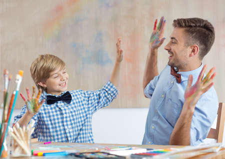 Picture of male art class teacher and his happy pupilの写真素材