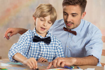 Picture of creative father supporting his talented boyの写真素材