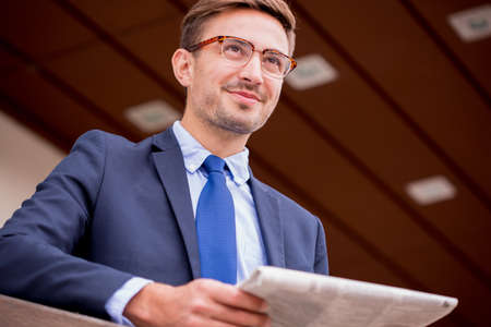 Image of male member of working delegation waiting for transportの写真素材
