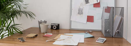 Desk of young fashion designer - horizontal view