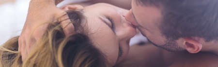 Young couple is kissing during morning sex