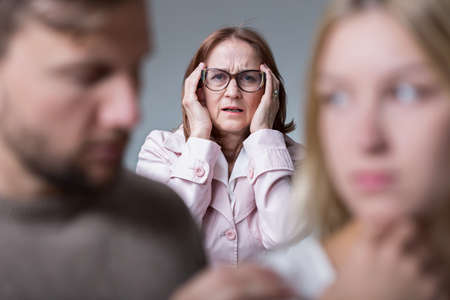 Woman concerned about negative tensions in familyの写真素材