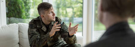 Soldier talking about war to his psychotherapistの写真素材