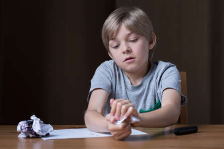 Little boy has too much aggression in himselfの写真素材