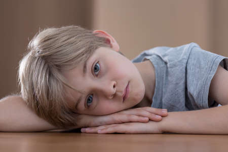 Young boy is sad because of his parents divorceの写真素材