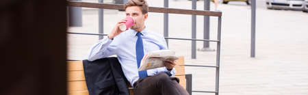 Young businessman is waiting at the stationの写真素材