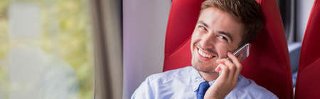 Young businessman is calling to his bossの写真素材