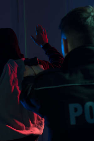 Cop pointing handgun at offender during actionの写真素材