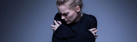 Panorama of an abandoned skinny woman with mental illnessの写真素材