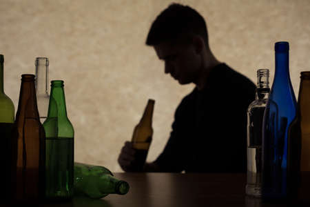 Adolescent drinking beer - alcoholism among young adultsの写真素材