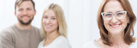 Elder lady is happy because of her son's relationshipの写真素材