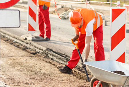 Male construction worker has to work in the sunny dayの写真素材