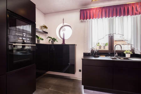 Oven in the black kitchen in the diamond houseの写真素材