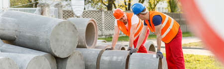 Construction workers are trying to lift the kerbs