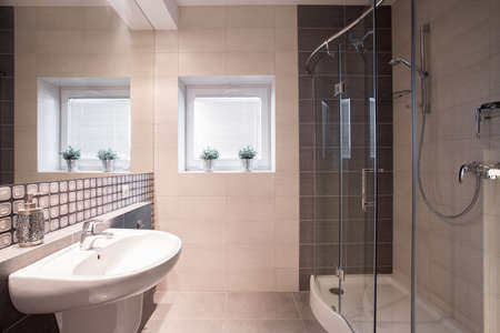 Image of fancy black and white bathroom with big shower