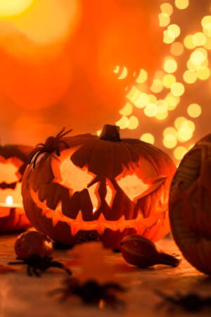 Carved orange halloween pumpkin on the table