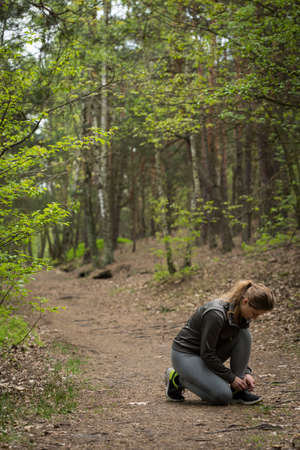 Image of young sport girl training in the forestの写真素材